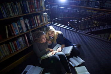 Two female students learning in a library - ZEF000103