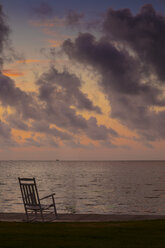 USA, Texias, Rocking chair at beach, Early morning at the Gulf Coast - ABAF001456