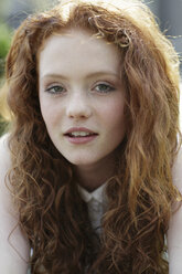 Portrait of girl with curly red hair and freckles - GDF000412