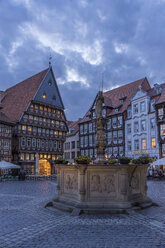Germany, Lowe Saxony, Hildesheim, Market place, Roland fountain and Butchers' Guild Hall in the evening - PVCF000097