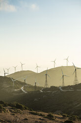 Spain, Andalusia, Tarifa, Wind farm on a road - KBF000154