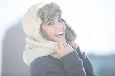 Portrait of laughing woman wearing wool cap - ZEF000776
