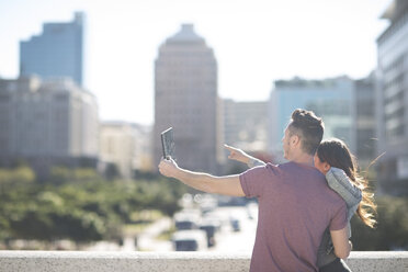 Young couple taking a photo with digital tablet - ZEF000814