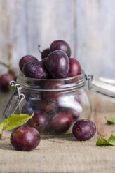 Preserving jar of plums on jute - ODF000807