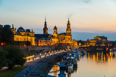 Germany, Saxony, Dresden, View of Bruehl's Terrace, Sekundogenitur, Hausmann Tower, House of the Estates, Dresden Cathedral, Semper Opera House and Augustus bridge with Elbe waterfront in the evening - WGF000430