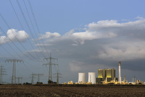 Germany, Saxony-Anhalt, Schkopau, power pylons and coal-fired power plant - LYF000280