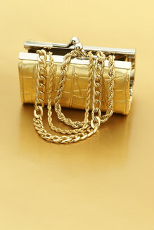 Open gold purse with gold jewelry - JAWF000036
