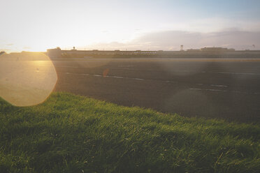 Germany, Berlin, Tempelhofer Feld, former Berlin Tempelhof airport former runway against the sun - ZMF000336