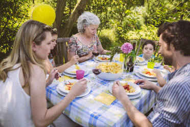 Family of three generations at a garden party - MFF001247