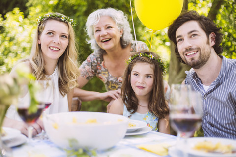 Happy family of three generations on a garden party stock photo
