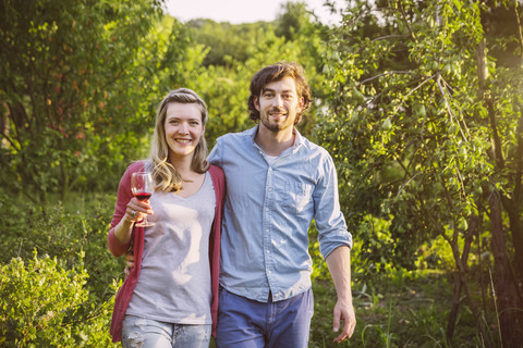 Portrait of couple in garden in evening light stock photo