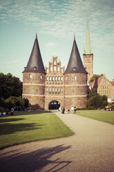 Germany, Schleswig-Holstein, Luebeck, Holsten Gate, Saint Peter's Church in the background - KRPF001022