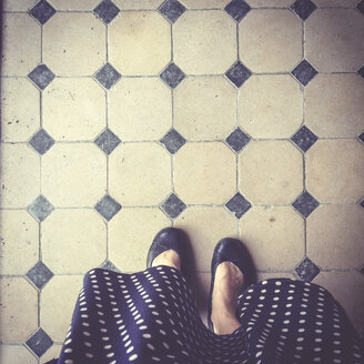Germany, Bavaria, woman standing on old tiled floor - LVF001829