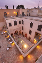 Morocco, Fes, Hotel Riad Fes, lightened courtyard at twilight - KMF001425