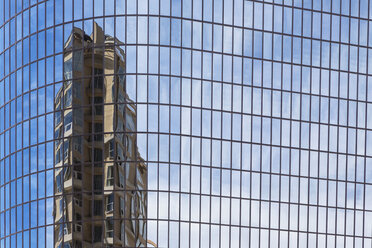 USA, California, Los Angeles, Reflection of an high-rise building in a glass facade - FOF006935