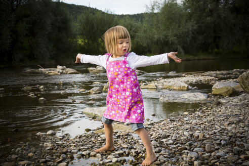 Little girl dancing at riverside - LVF001790