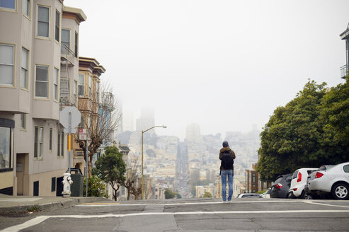 USA, California, San Francisco, woman on street taking a picture - BRF000738