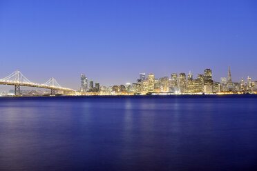 USA, California, San Francisco, Oakland Bay Bridge and skyline of Financial District in the blue hour - BR000705