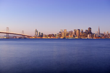 USA, California, San Francisco, Oakland Bay Bridge and skyline of Financial District at sunrise - BR000782