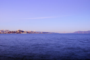 USA, California, San Francisco, Golden Gate Bridge and Skyline of North Beach and Telegraph Hill at sunrise - BRF000707