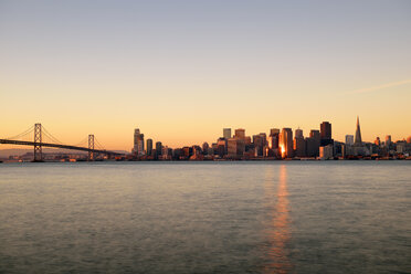 USA, California, San Francisco, Oakland Bay Bridge and skyline of Financial District in morning light - BRF000786