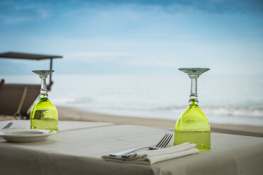 Mexico, Jalisco, Puerto Vallarta, laid table at beach front restaurant - ABAF001461