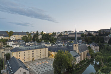 Luxembourg, Luxembourg City, View to Neumuenster convent at Alzette river and the city in the evening - MSF004209