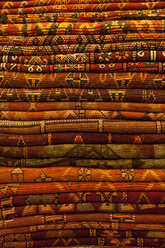 Morocco, Marrakesh, stack of traditional woven carpets - JUNF000035