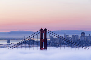 USA, California, San Francisco, skyline and Golden Gate Bridge in fog seen from Hawk Hill - FOF007013