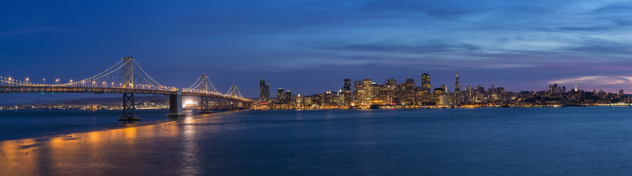 USA, California, San Francisco, Skyline and Oakland Bay Bridge in the evening - FO007060