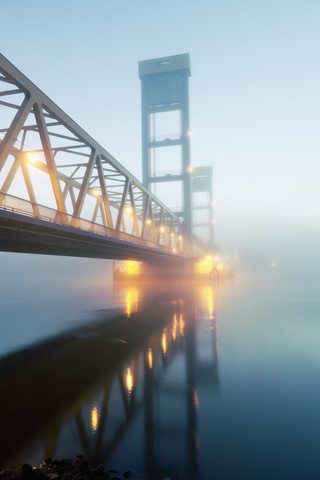 Germany, Hamburg, Bridge with early morning fog stock photo
