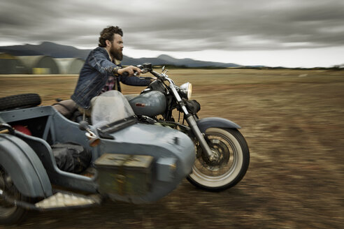 Man with full beard driving motorcycle with sidecar - KOF000034
