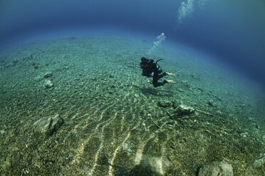 Austria, Styria, Tragoess, Diver at the Green Lake - ZCF000181