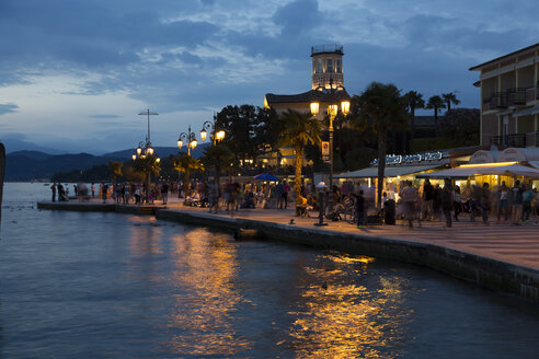 Italy, Lake Garda, Lazise, waterfront promenade at blue hour - SARF000817