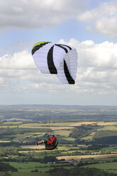 France, Bretagne, Finistere, paraglider up in the air - LAF001042