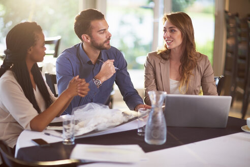 Business meeting of three people in a restaurant - ZEF000894