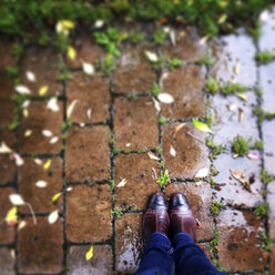 Feet of woman standing in rain - LVF001919