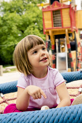 Little girl on playground in nest swing - LVF001881