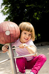 Happy little girl on playground - LVF001885