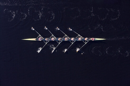 Elevated view of female's rowing eight in water - ZE000452