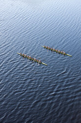 Elevated view of two rowing eights in water - ZEF000456