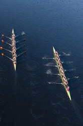 Elevated view of two rowing eights in water - ZEF000475