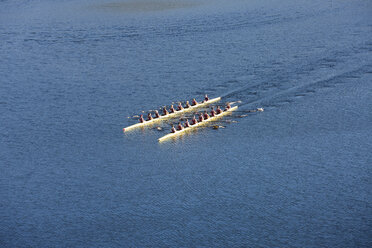 Elevated view of two rowing eights in water - ZEF000476