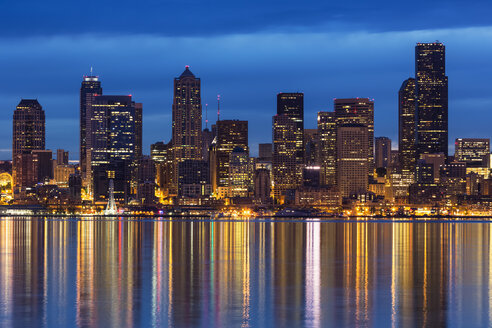 USA, Washington State, Puget Sound and skyline of Seattle at blue hour - FOF007117