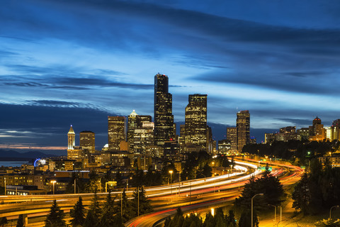 USA, Washington State, Seattle, Dr. Jose Rizal Park, Interstate 5 and skyline at blue hour stock photo