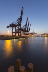 Germany, Hamburg, Port of Hamburg, Container Terminal Burchardkai in the evening - RJ000285