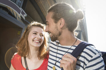 Germany, Berlin, Young couple walking in street - FKF000650