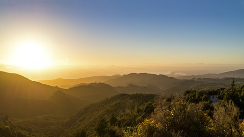 Australia, Queensland, sunrise above the ocean seen from mountains stock photo