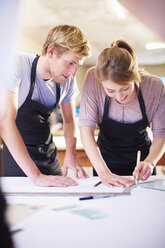 Couple in a workshop manufacturing stained glass - ZEF000940