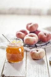 Glass of peach jam and doughnut peaches - SBDF001258